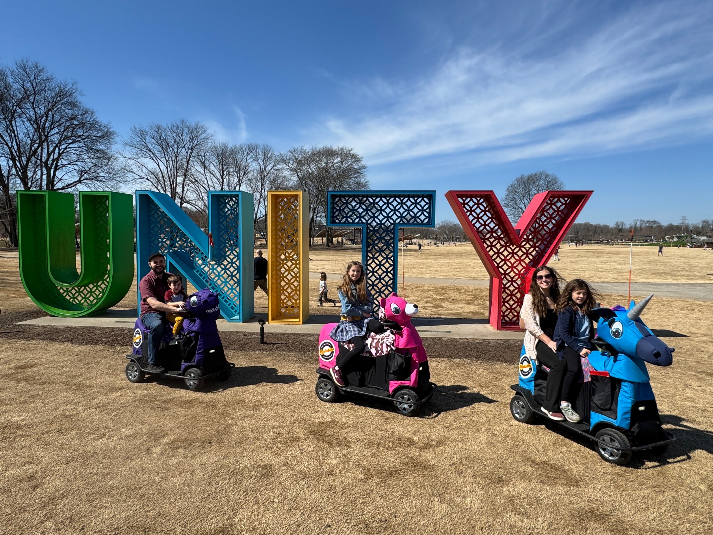 a group of people sitting at a park