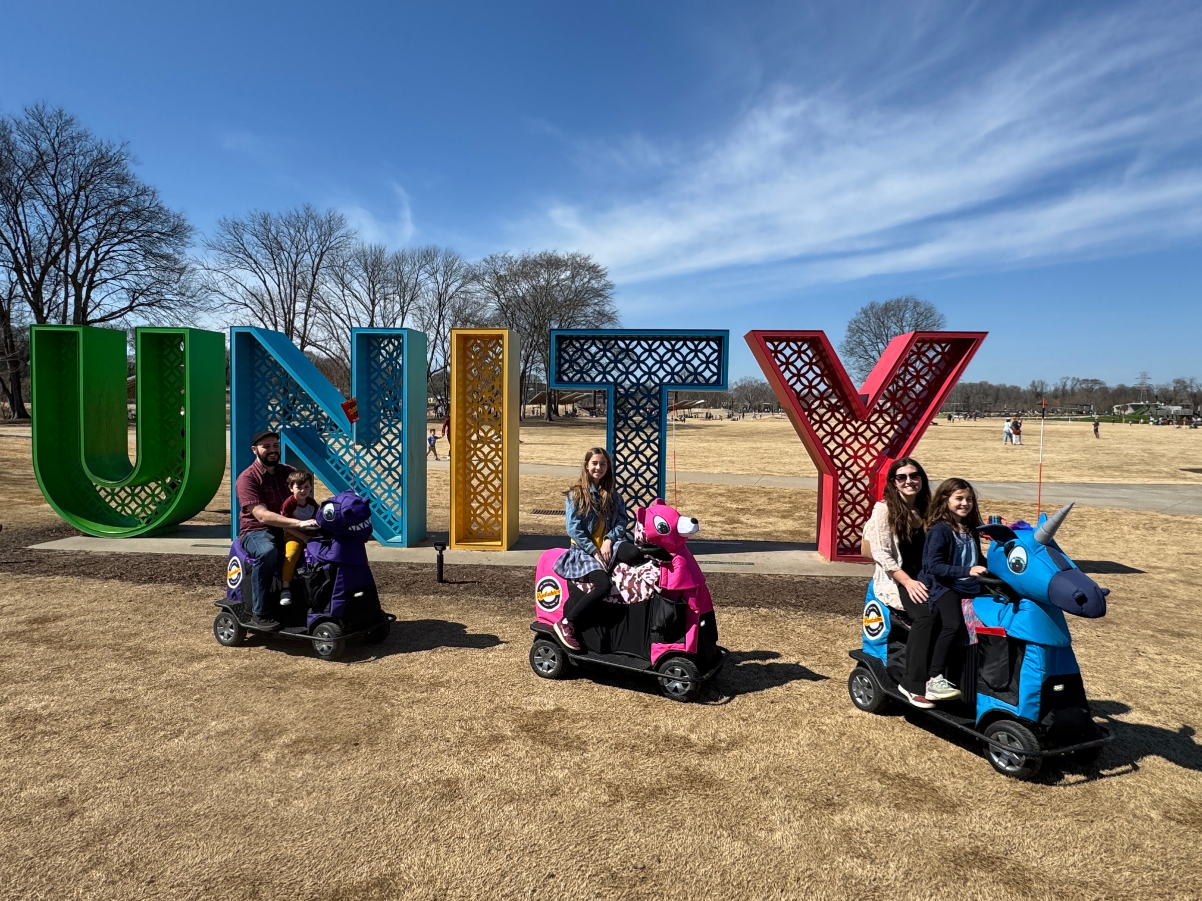 a group of people sitting at a park