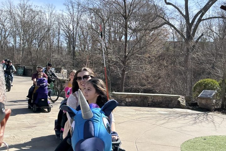 a group of people on a sidewalk
