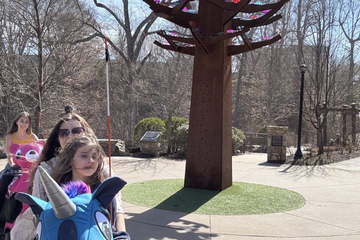 a woman sitting at a park