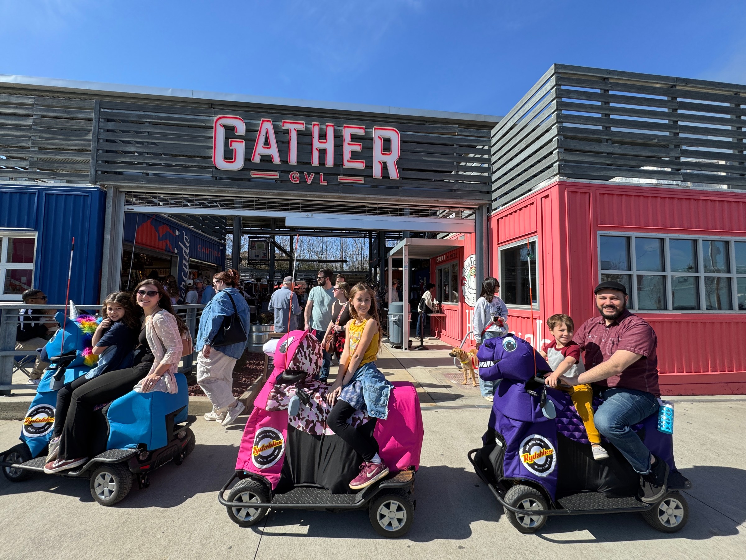a group of people standing in front of a building