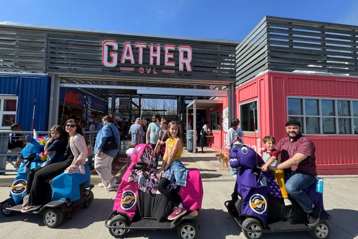 a group of people standing in front of a building